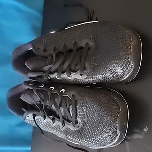 Black Nike running shoes.